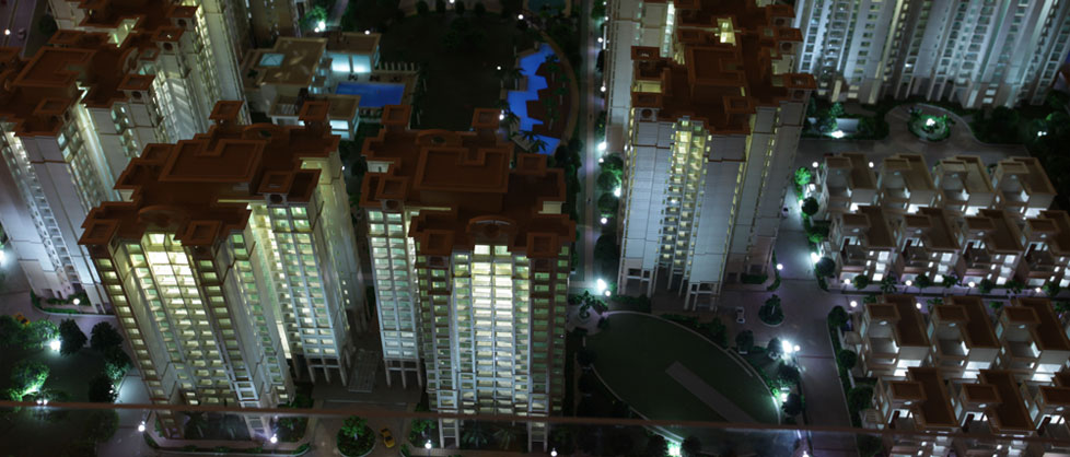 Elevated night view of the Godrej Anandam township model.